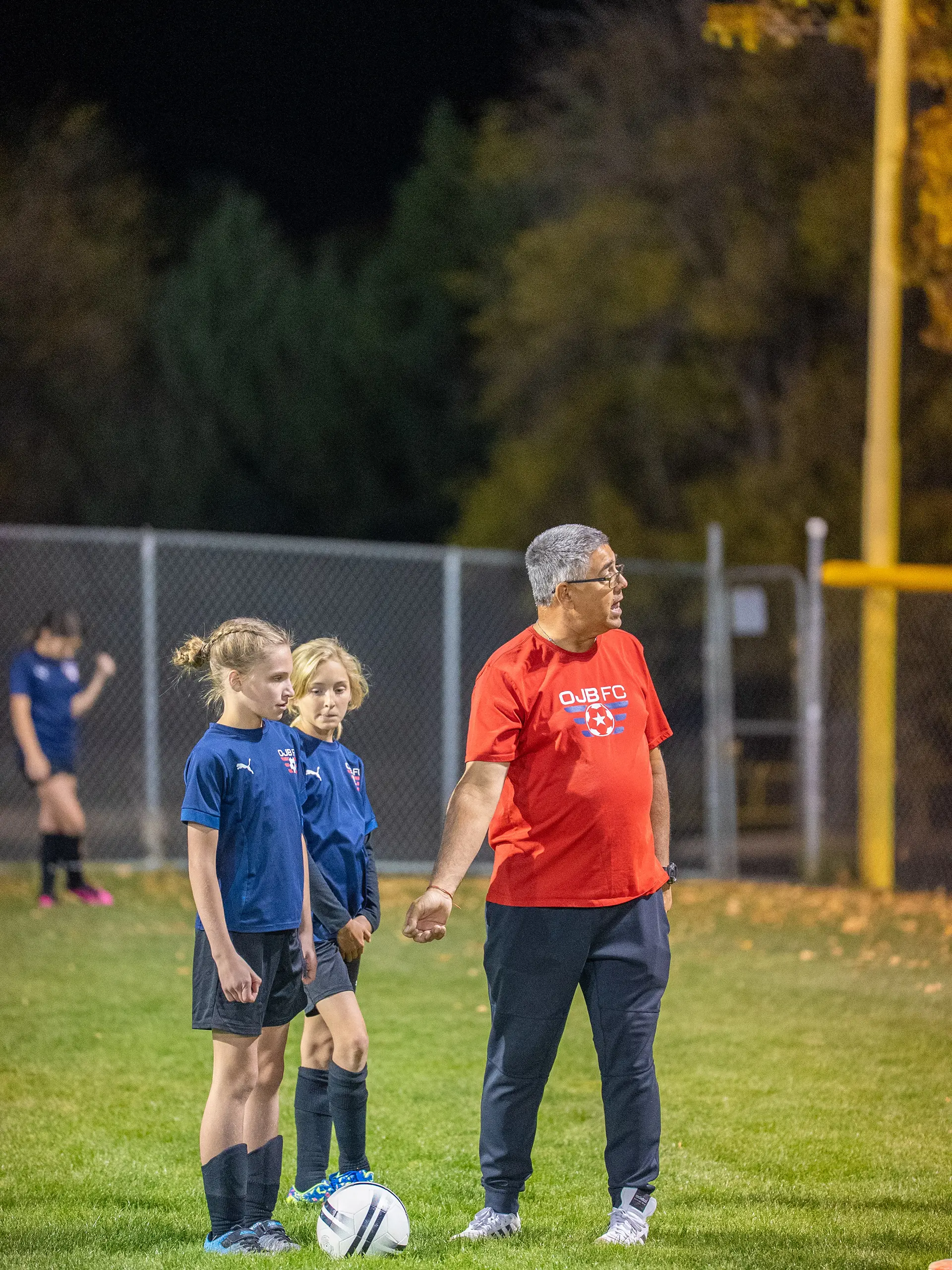 Soccer club game model Prescott AZ - Young girl instructing by there coach in Prescott Vally AZ at OJB FC