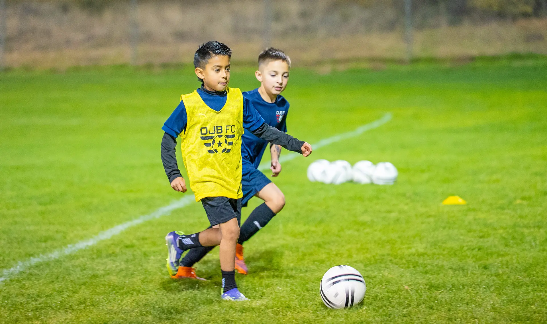 Young soccer players playing side by side in Prescott Valley AZ at OJB FC